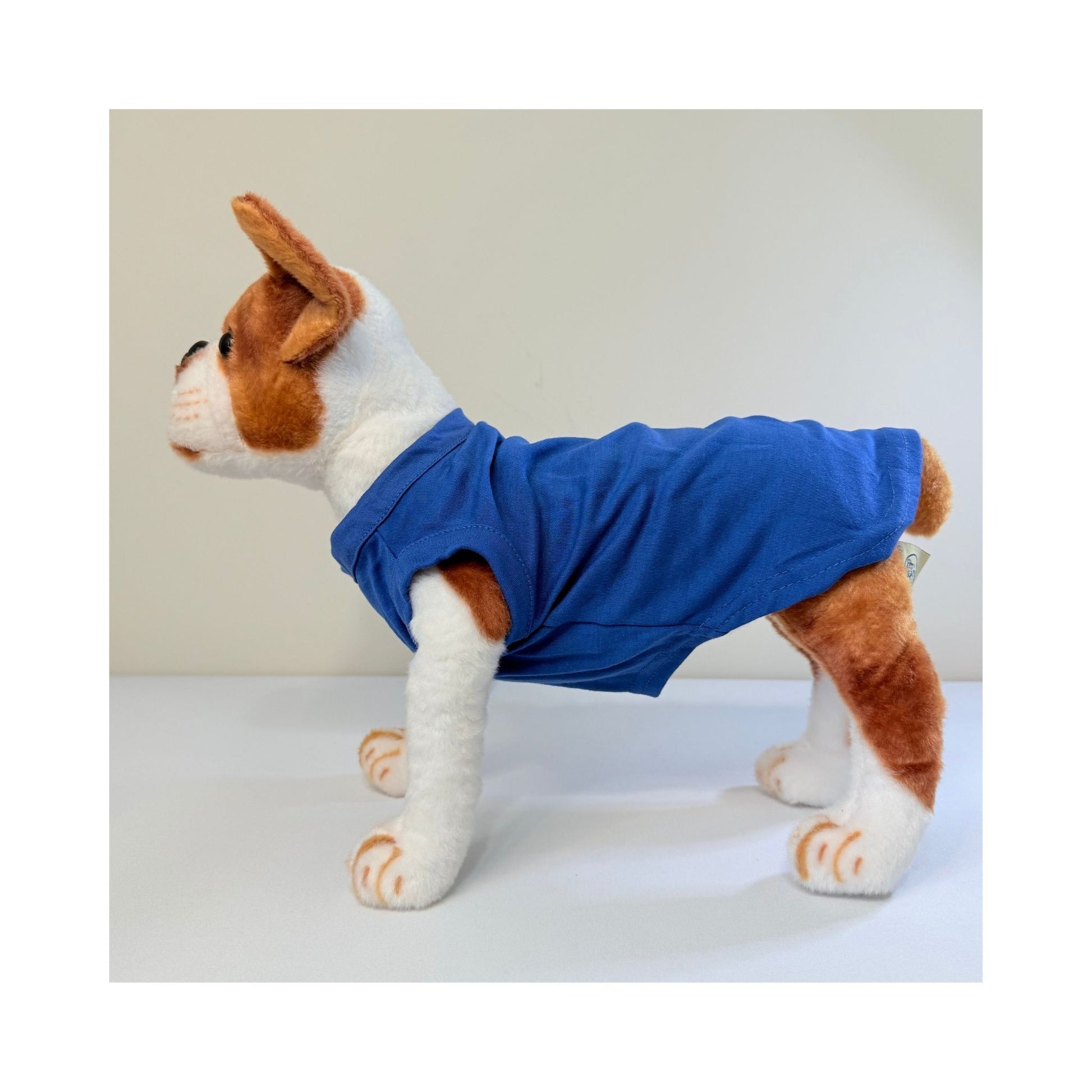 Full side profile of stuffed dog model wearing blue blank t-shirt - soft pet shirt for personalization, summer collections, or brand drops