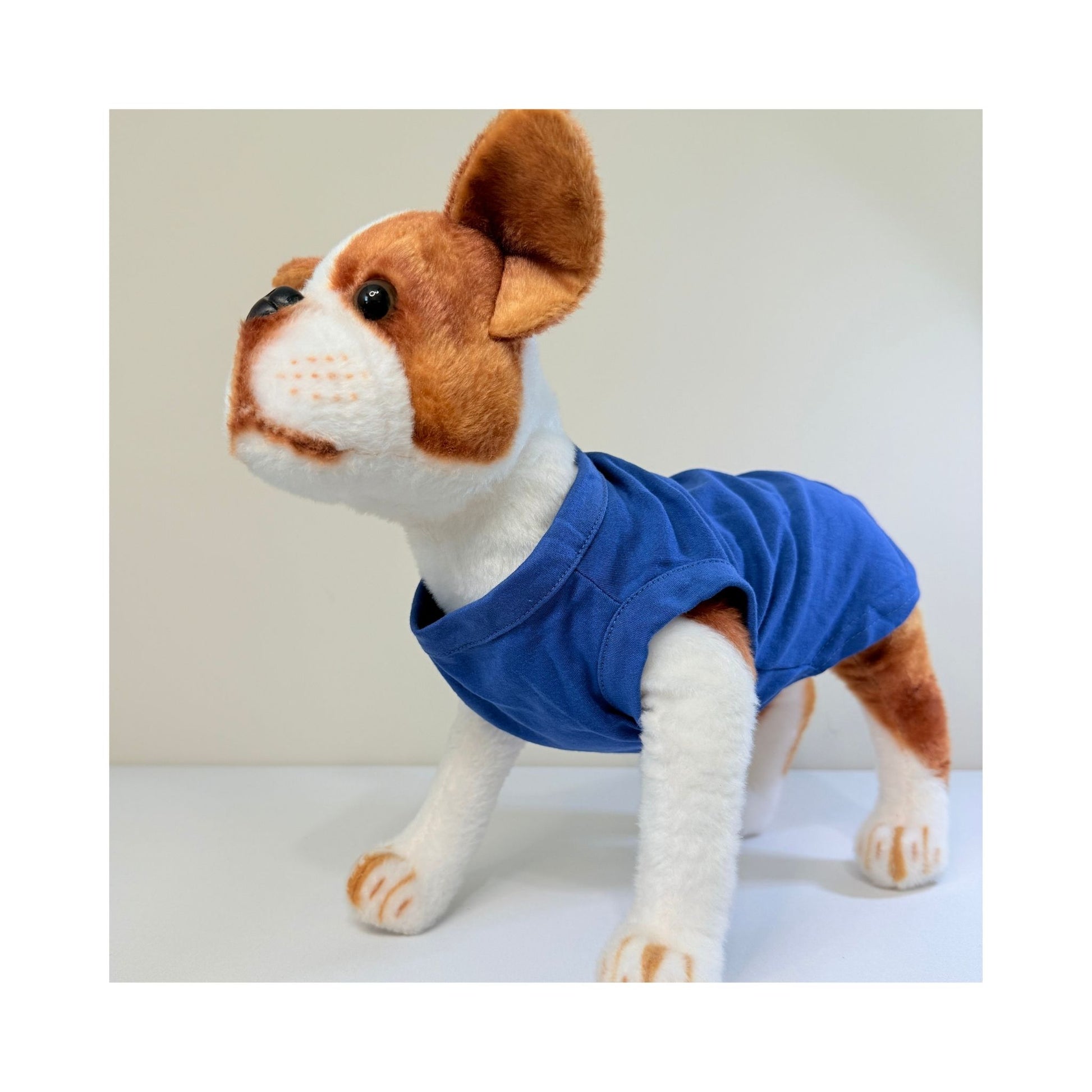 Side view of stuffed dog toy wearing blue blank t-shirt - sleeveless pet apparel for small dog brands, DIY crafters, and seasonal collections