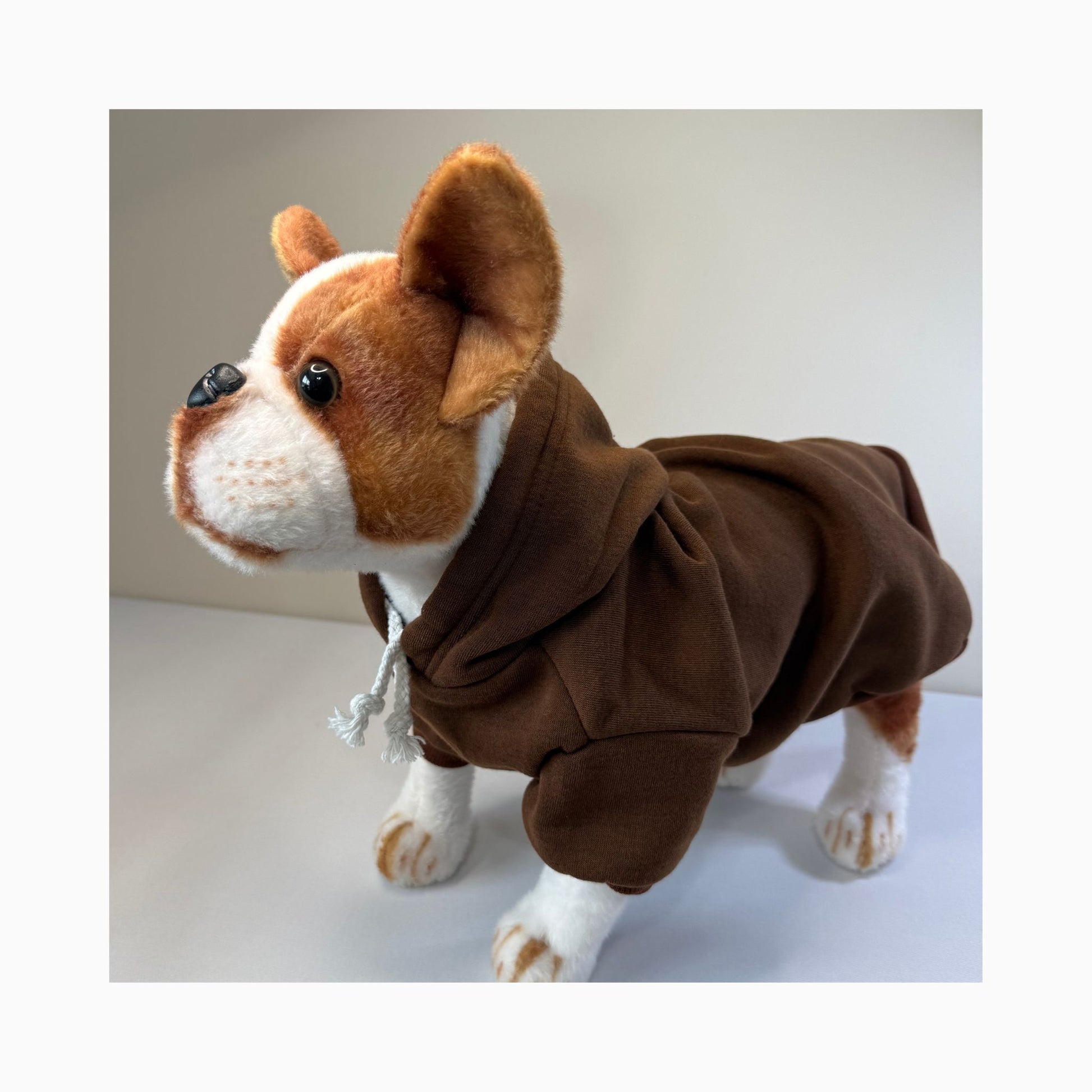 Side view of stuffed dog toy wearing a brown dog hoodie – blank pet apparel for small dogs and crafters
