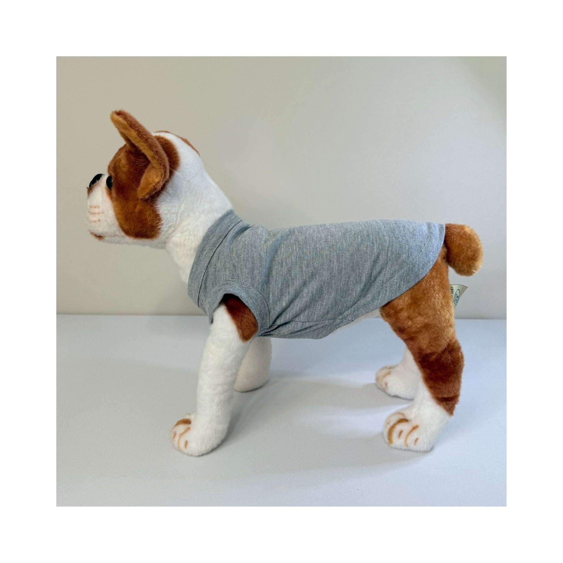 Stuffed dog model in gray blank dog t-shirt - profile side view showing length and sleeve fit