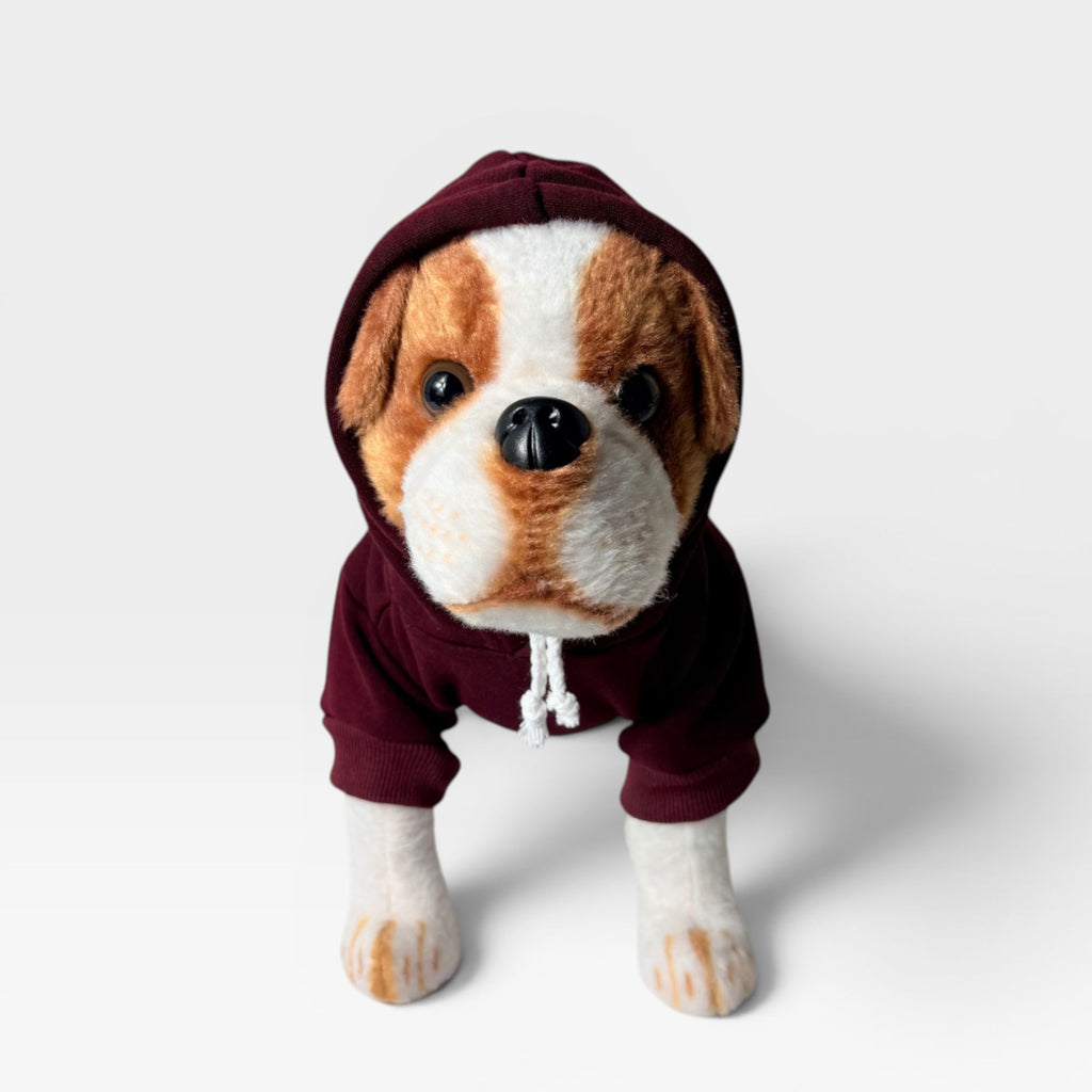 Maroon blank dog hoodie shown from the front with hood up on a dog model