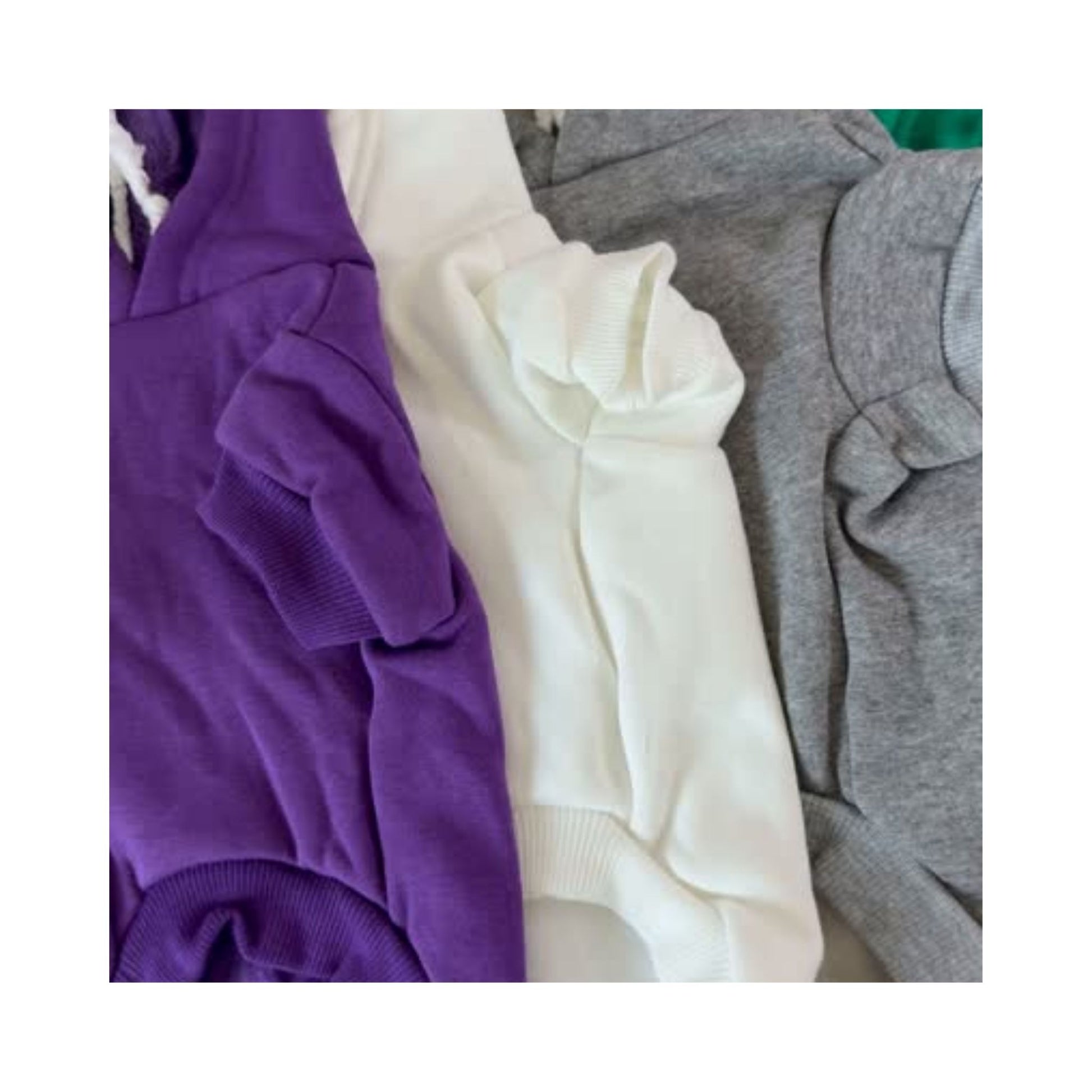 Video showing multiple blank dog hoodies in assorted colors with front and back views - soft, customizable apparel for pet brands and creators.