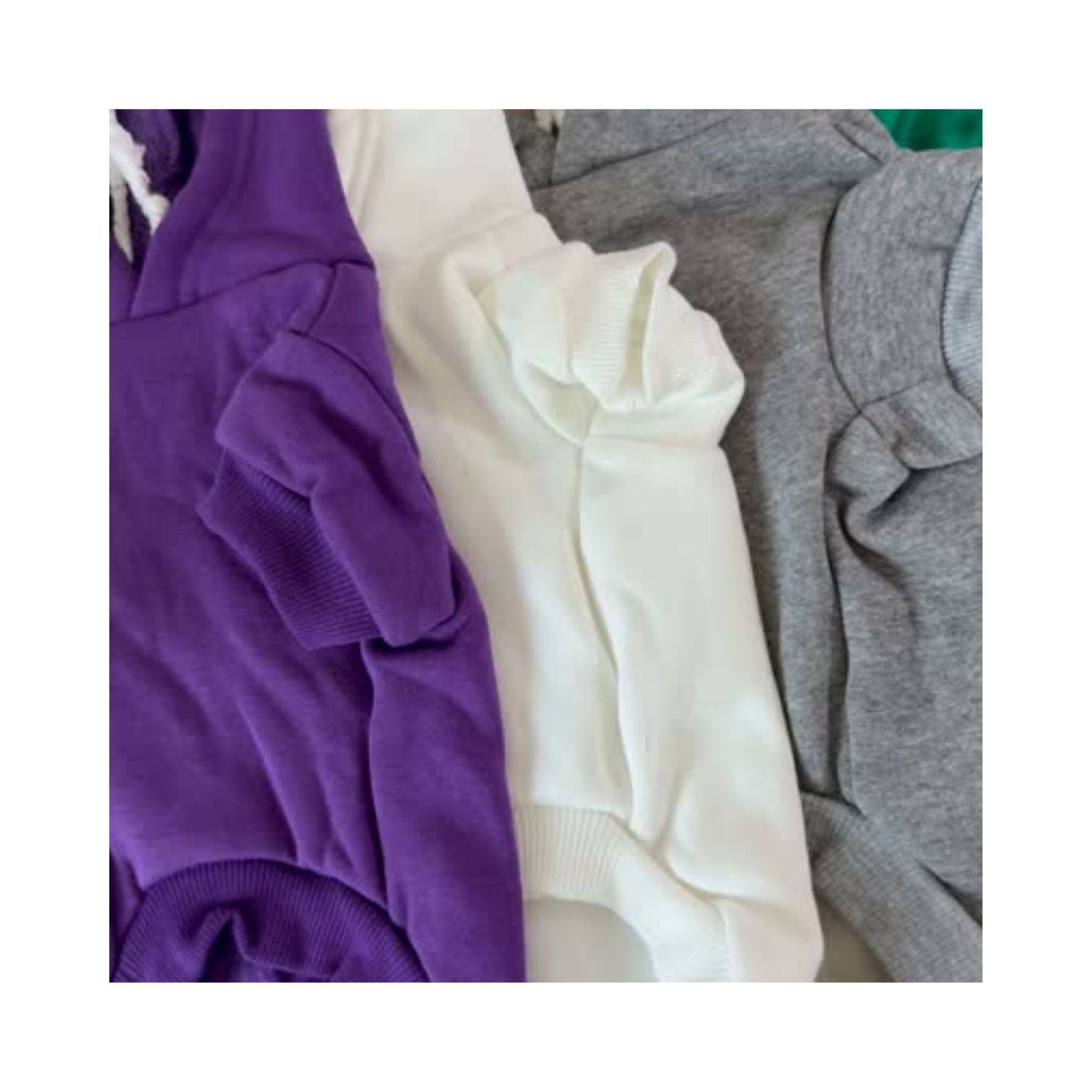 Video showing multiple blank dog hoodies in assorted colors with front and back views - soft, customizable apparel for pet brands and creators.